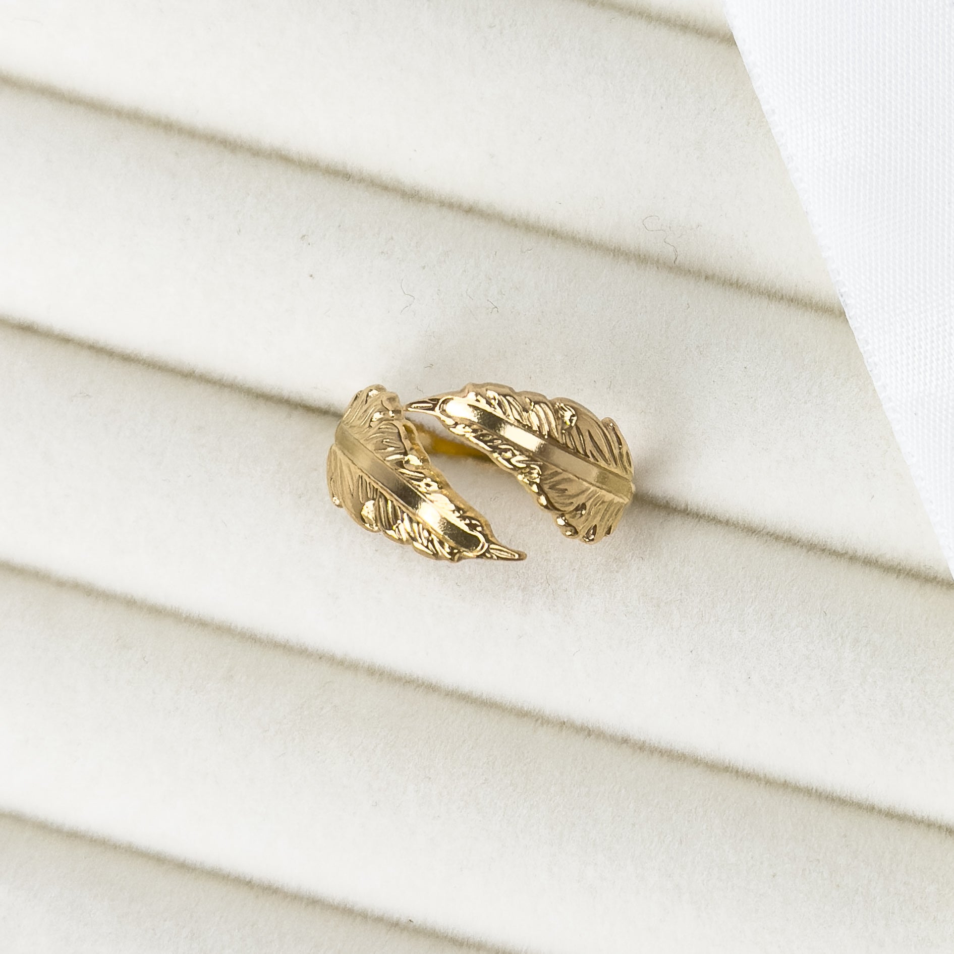 Gold adjustable ring with angel feather wrap design by Noble Aura UK. Fits most ring sizes.