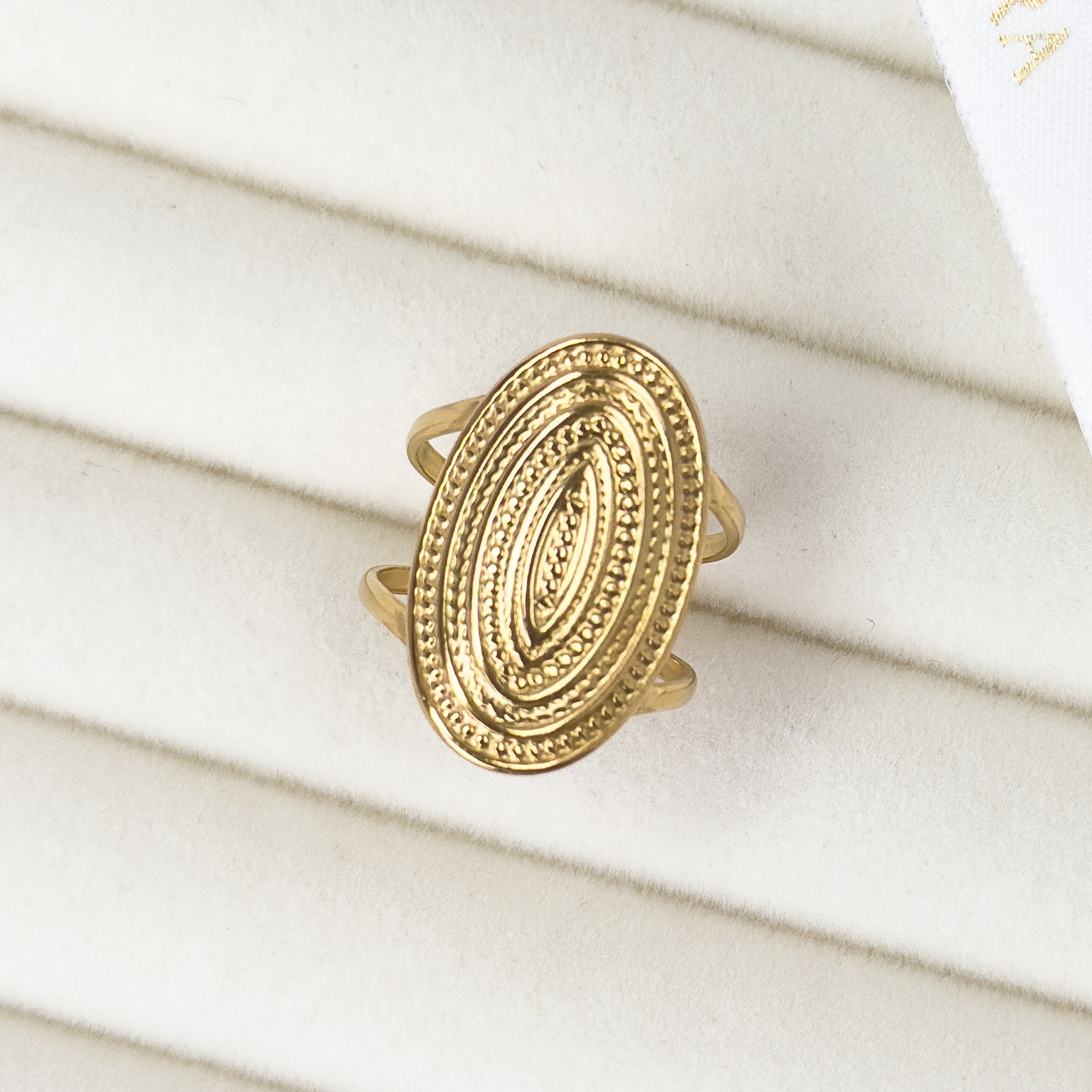 Gold oval ring with textured tribal pattern by Noble Aura UK. Adjustable – fits most ring sizes