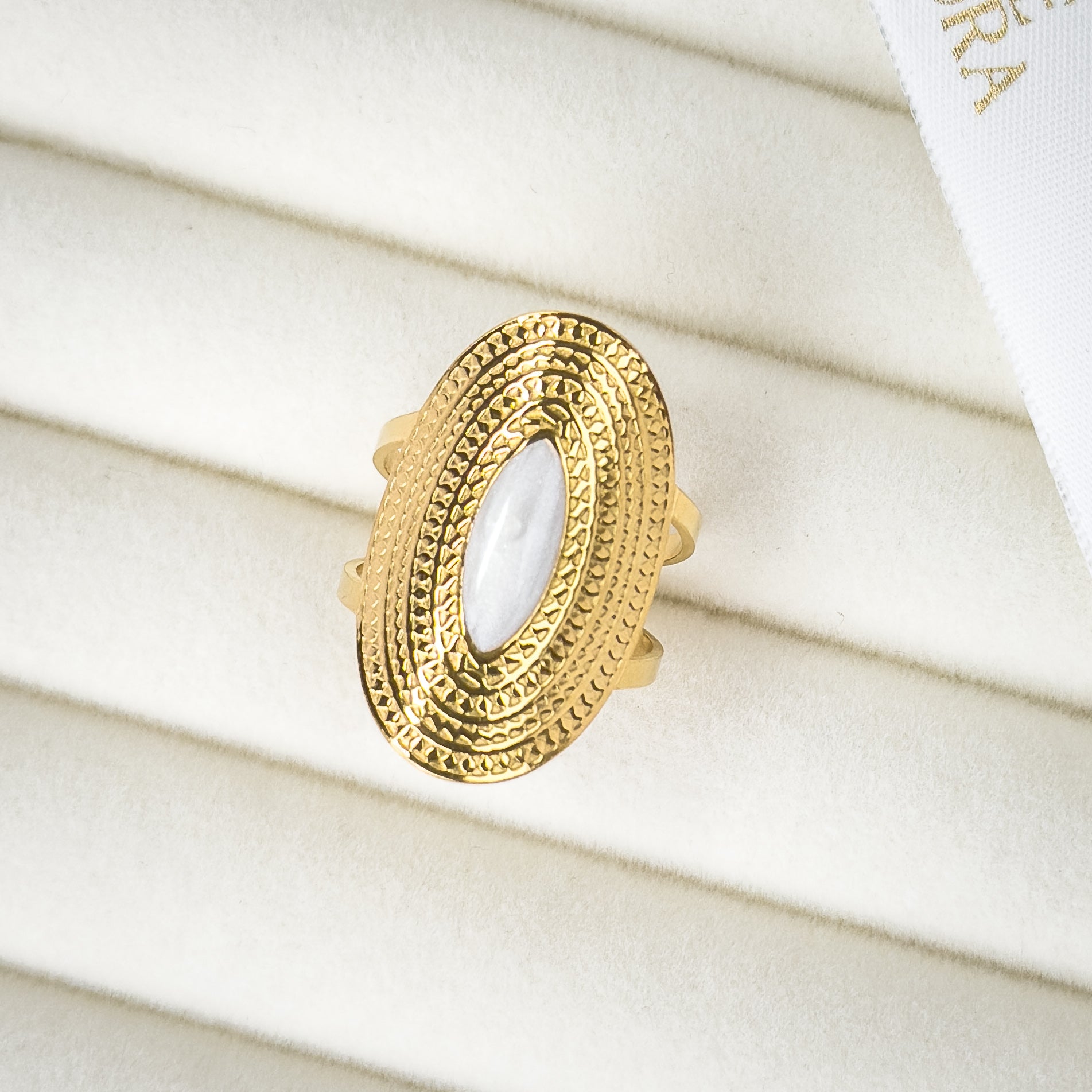 Gold oval ring with pearl centre and tribal detailing by Noble Aura UK