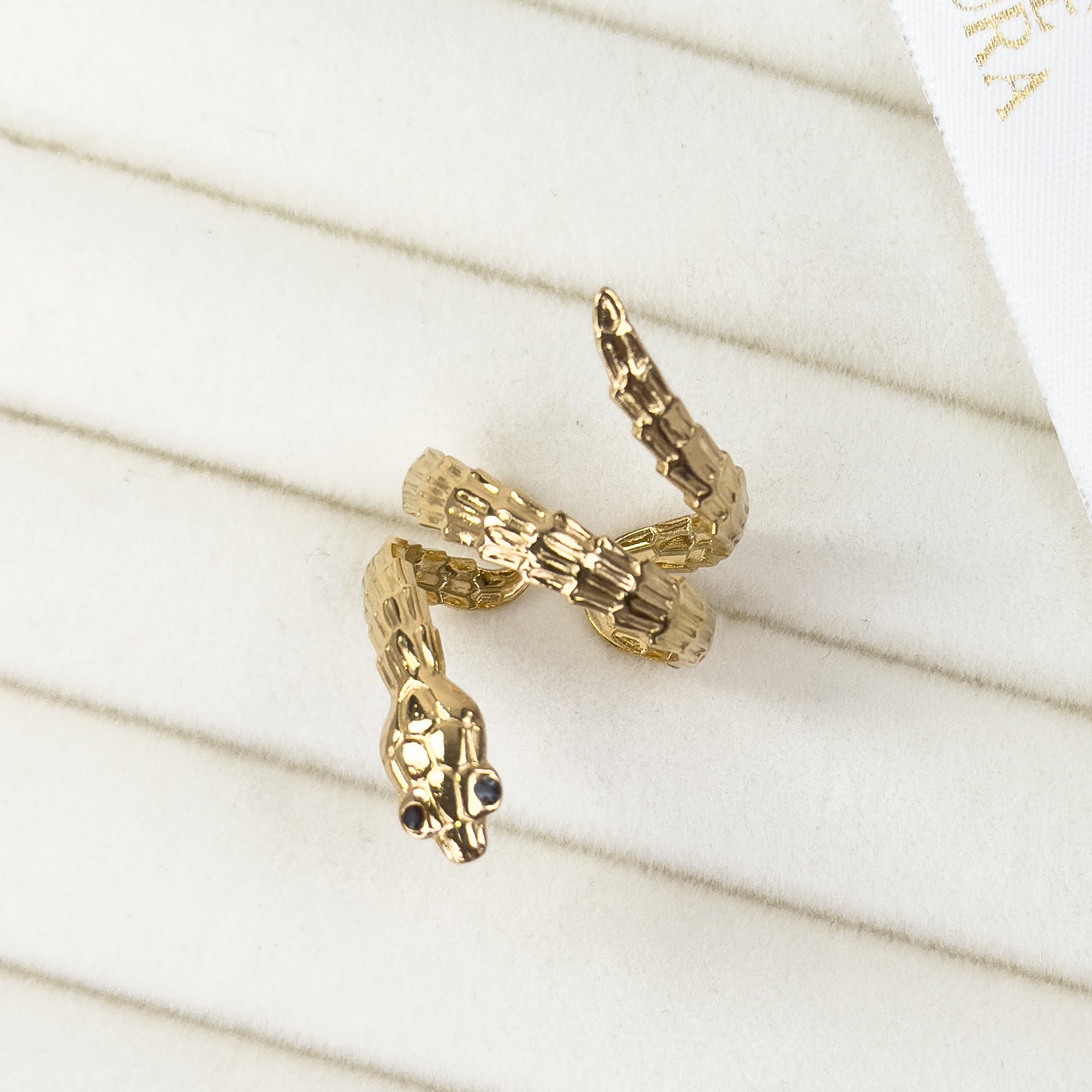 Gold snake wrap adjustable ring with sleek coiled design by Noble Aura UK