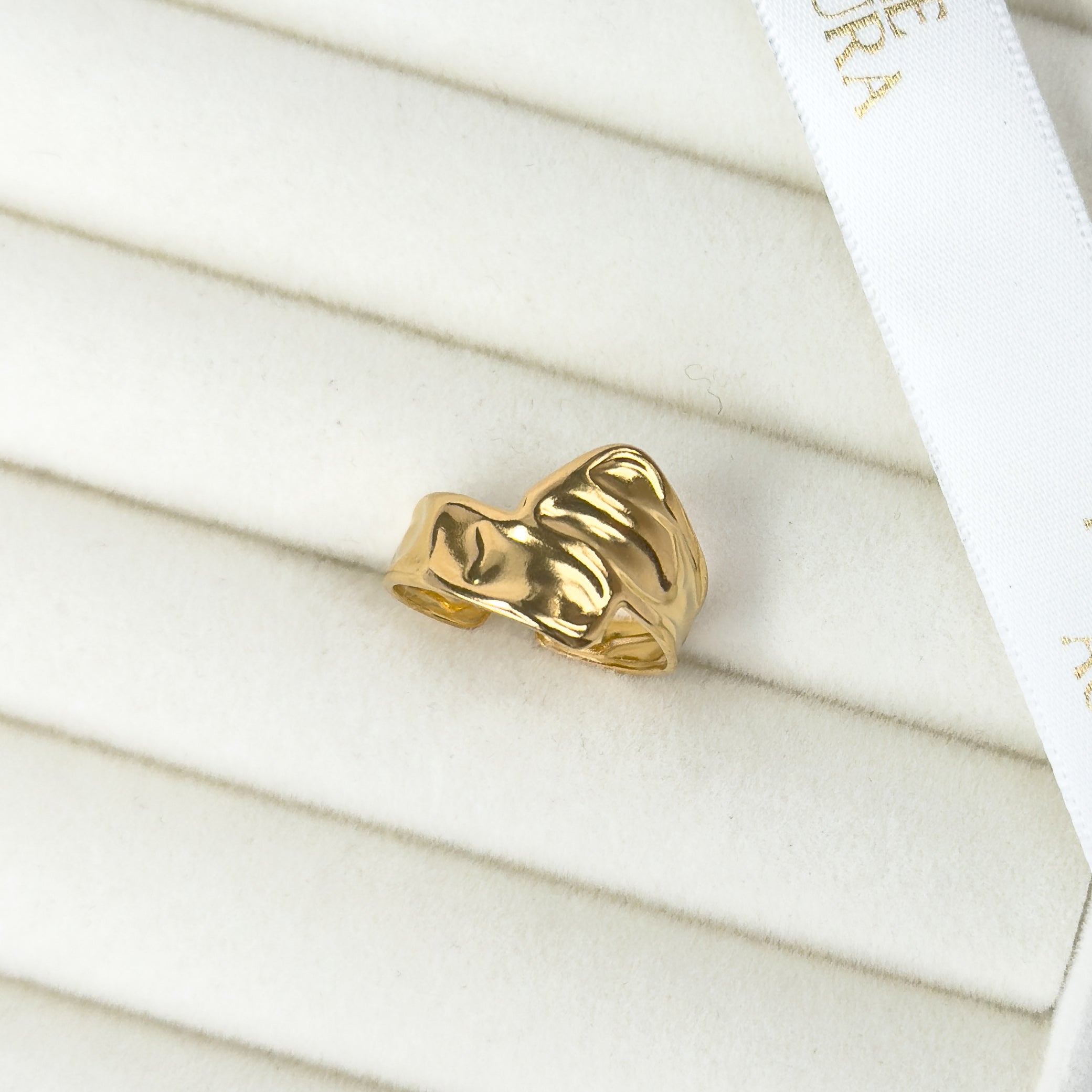 Gold wave ring with fluid curved design by Noble Aura UK