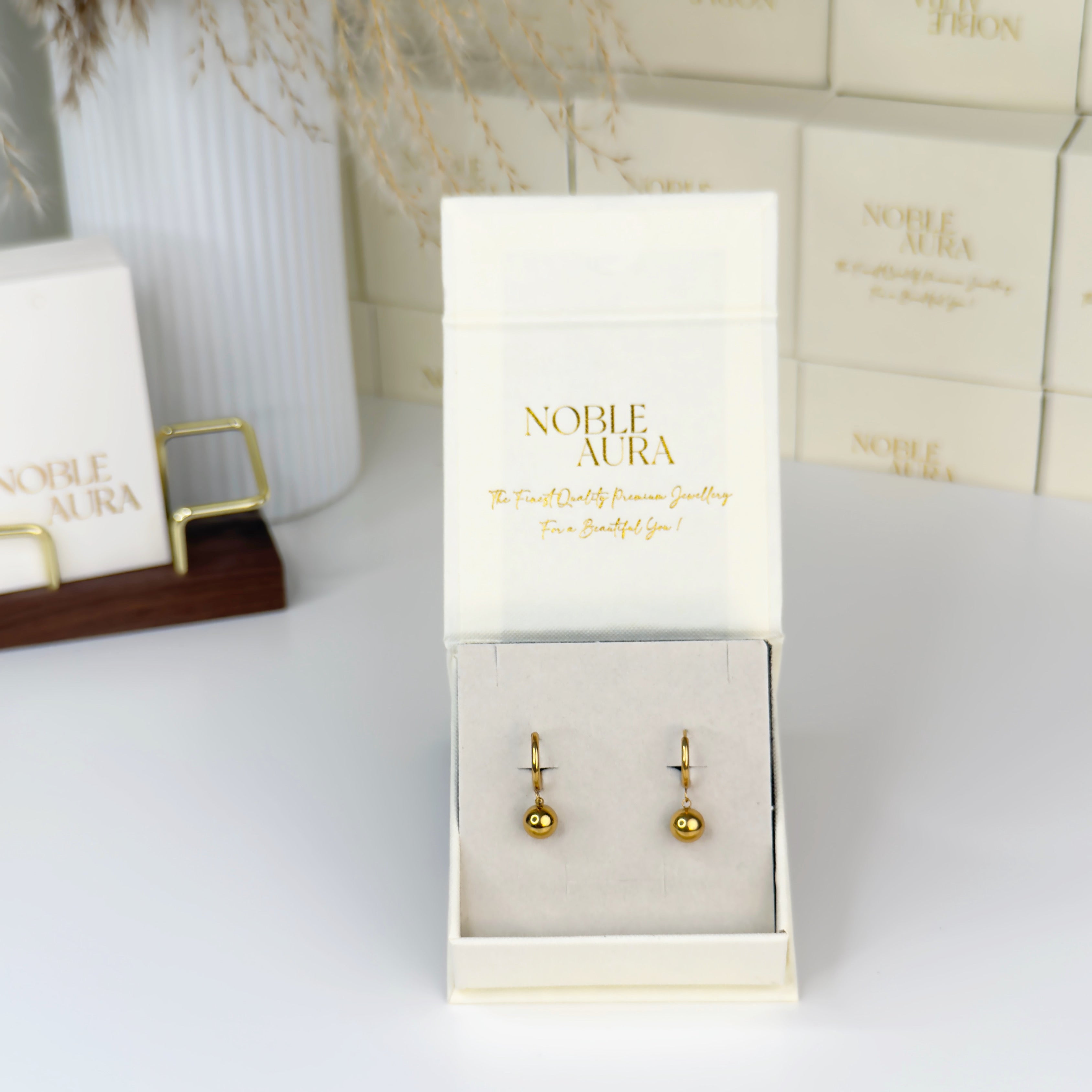 Minimalist gold ball drop hoop earrings by Noble Aura UK