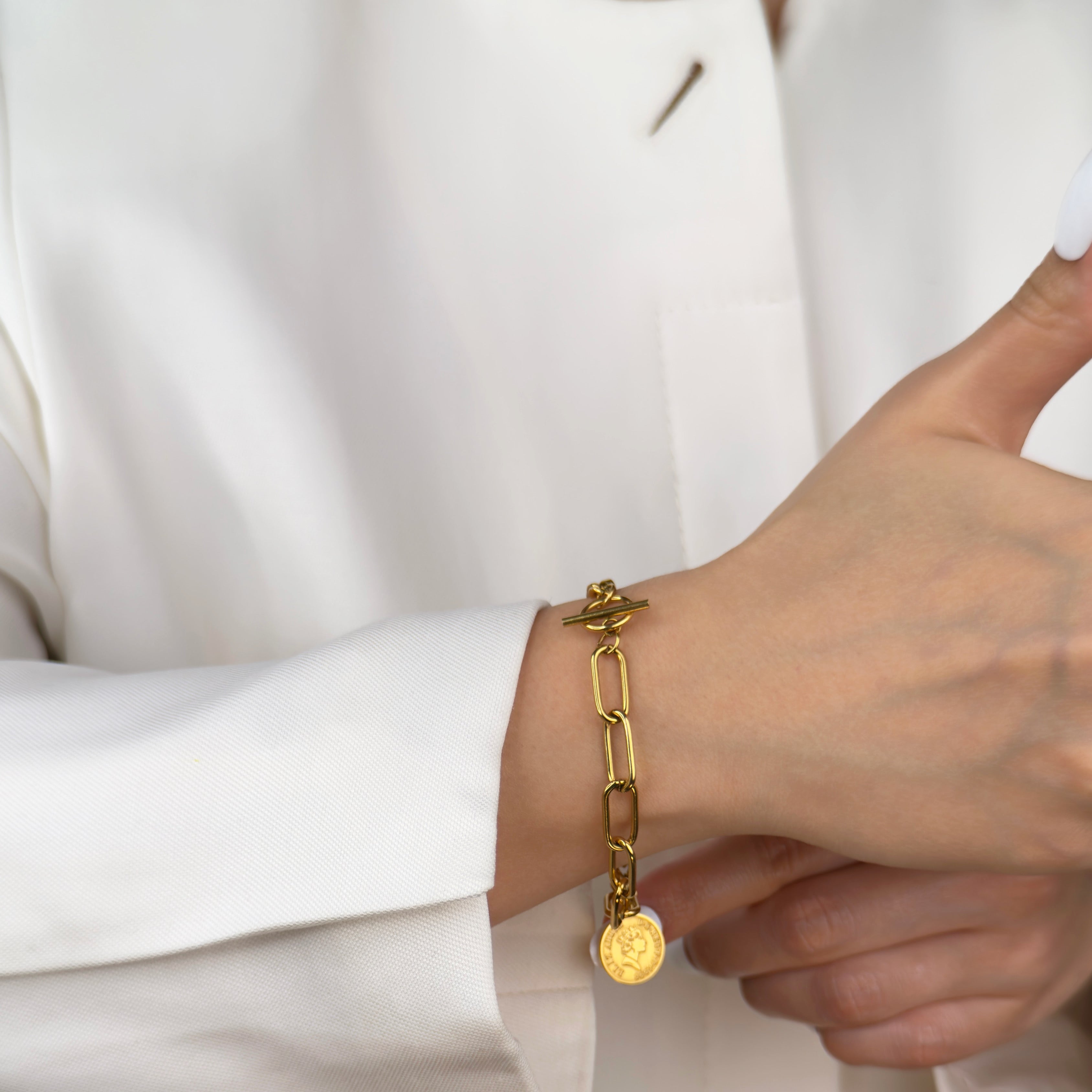 Gold coin pendant bracelet with chunky chain link and toggle clasp by Noble Aura UK