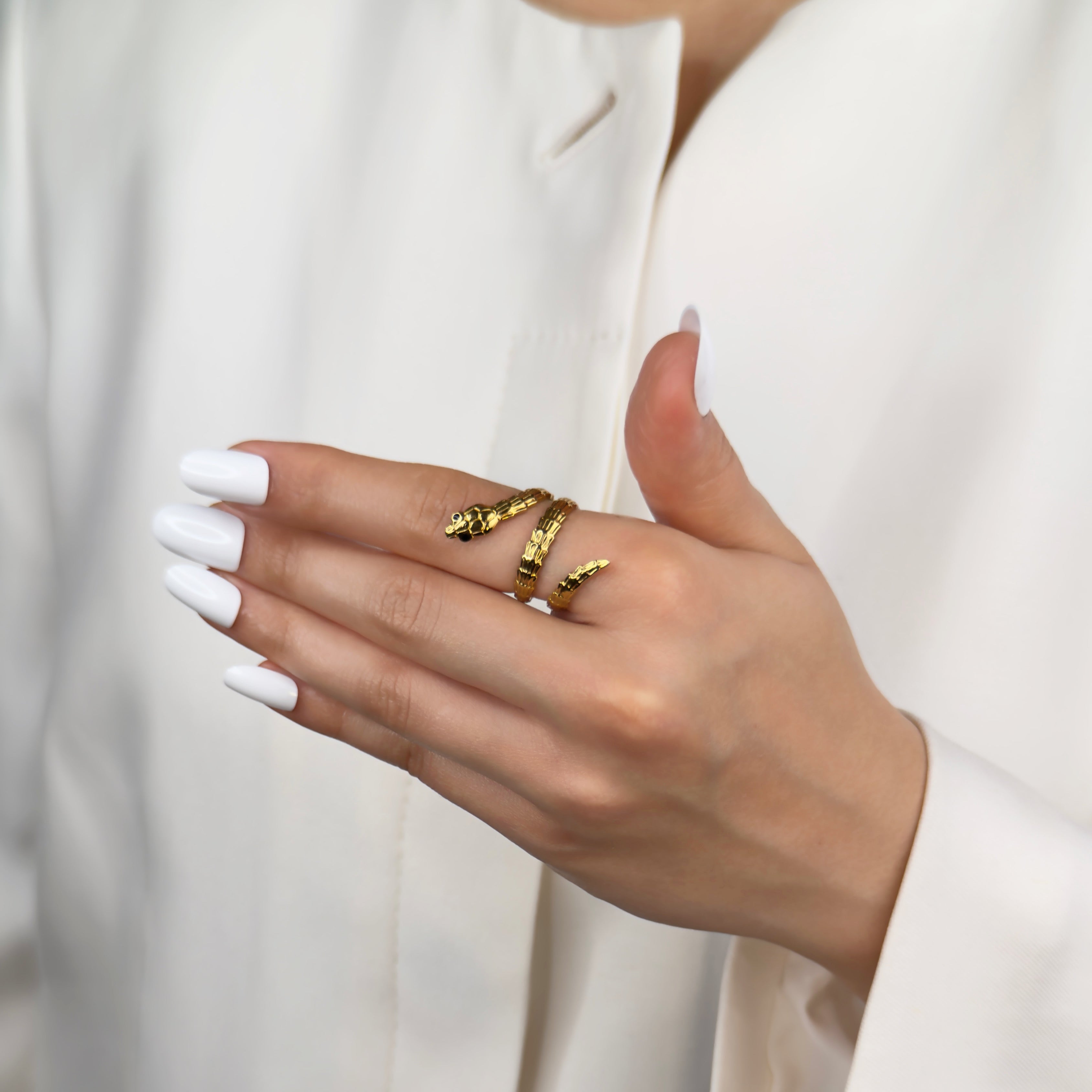 Gold snake wrap adjustable ring with sleek coiled design by Noble Aura UK