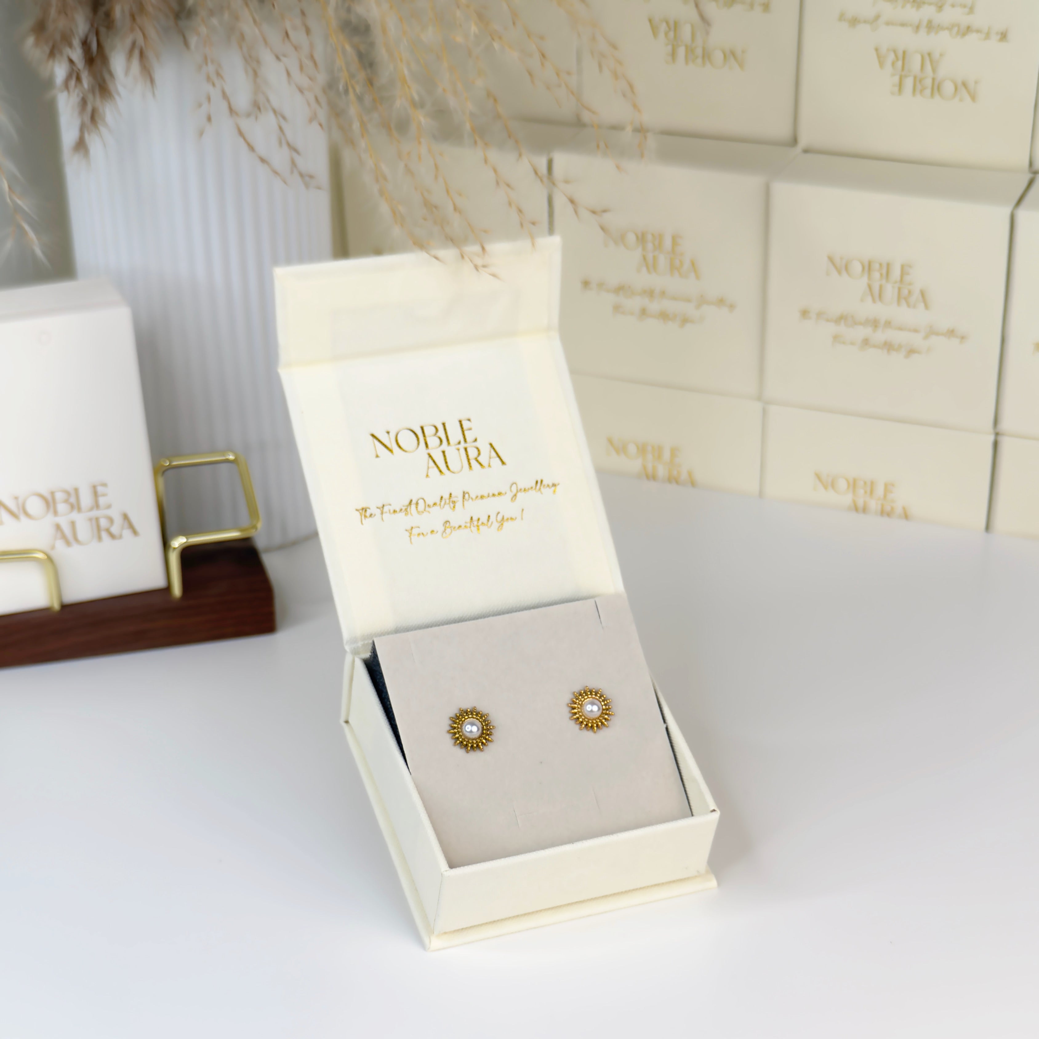 Gold sunburst pearl stud earrings in baroque inspired design by Noble Aura Jewellery London, United Kingdom