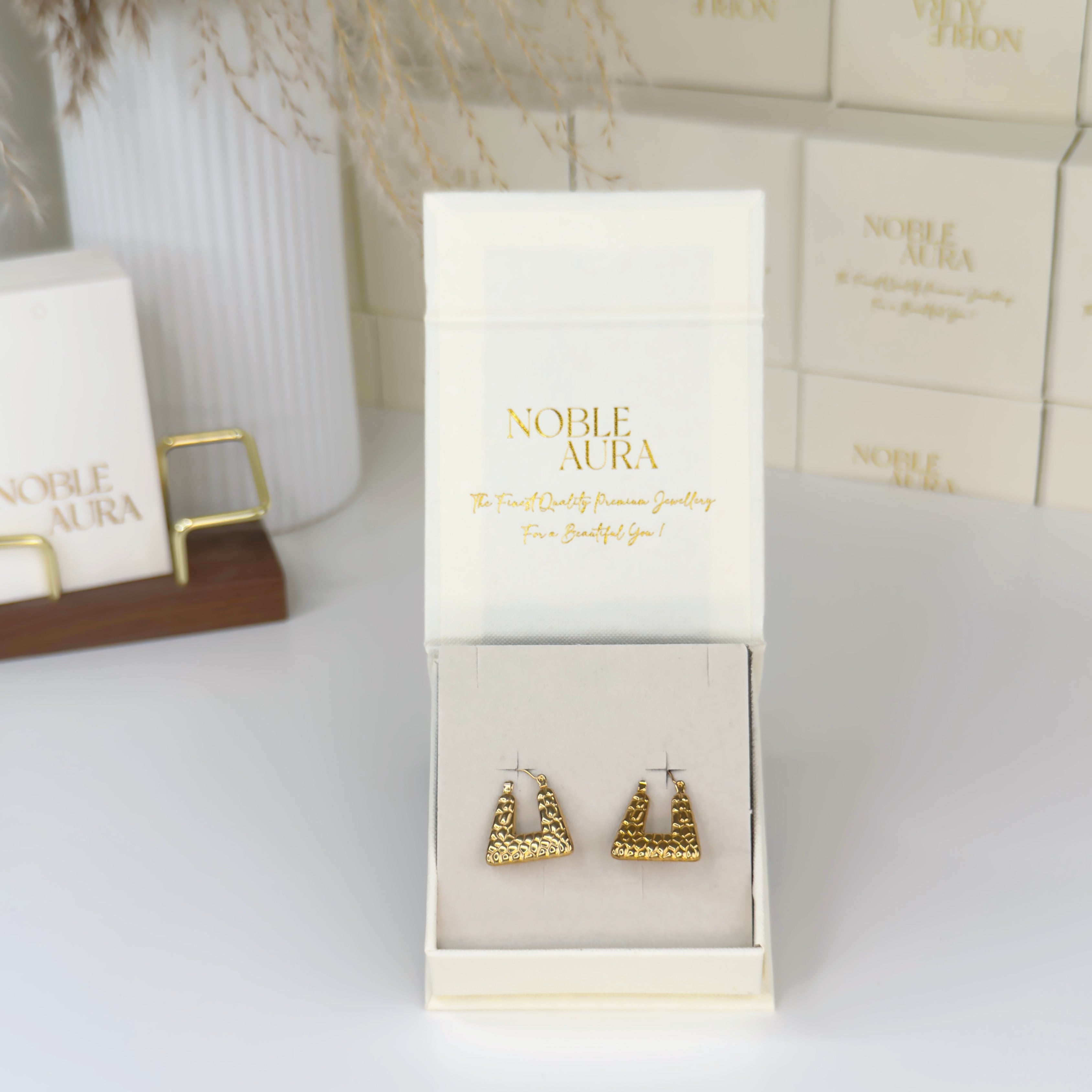 Gold geometric hoop earrings with textured finish by Noble Aura UK