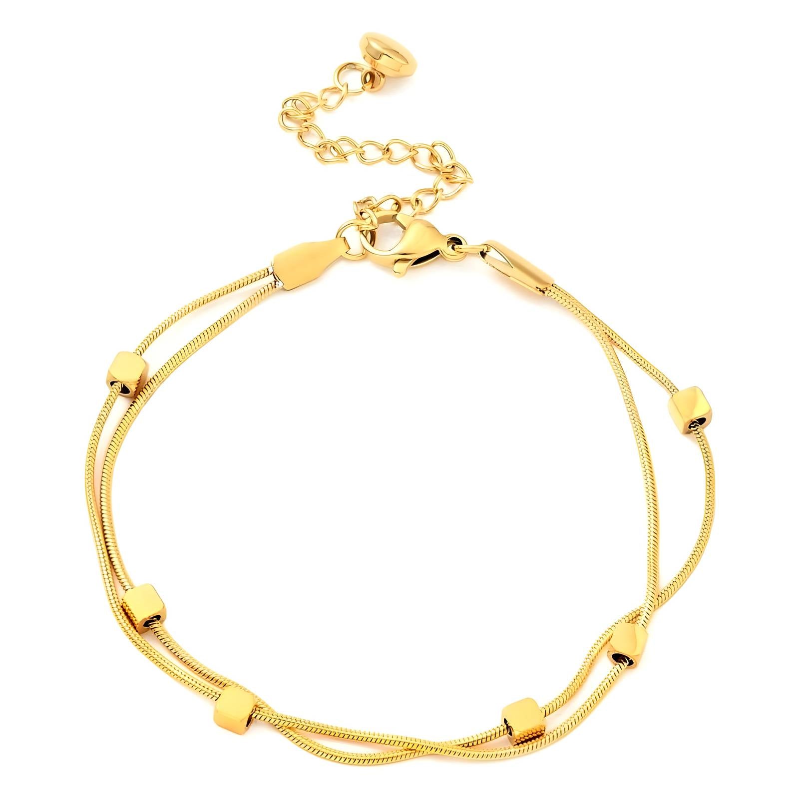 Minimalist gold snake chain bracelet for layering by Noble Aura Jewellery London, UK
