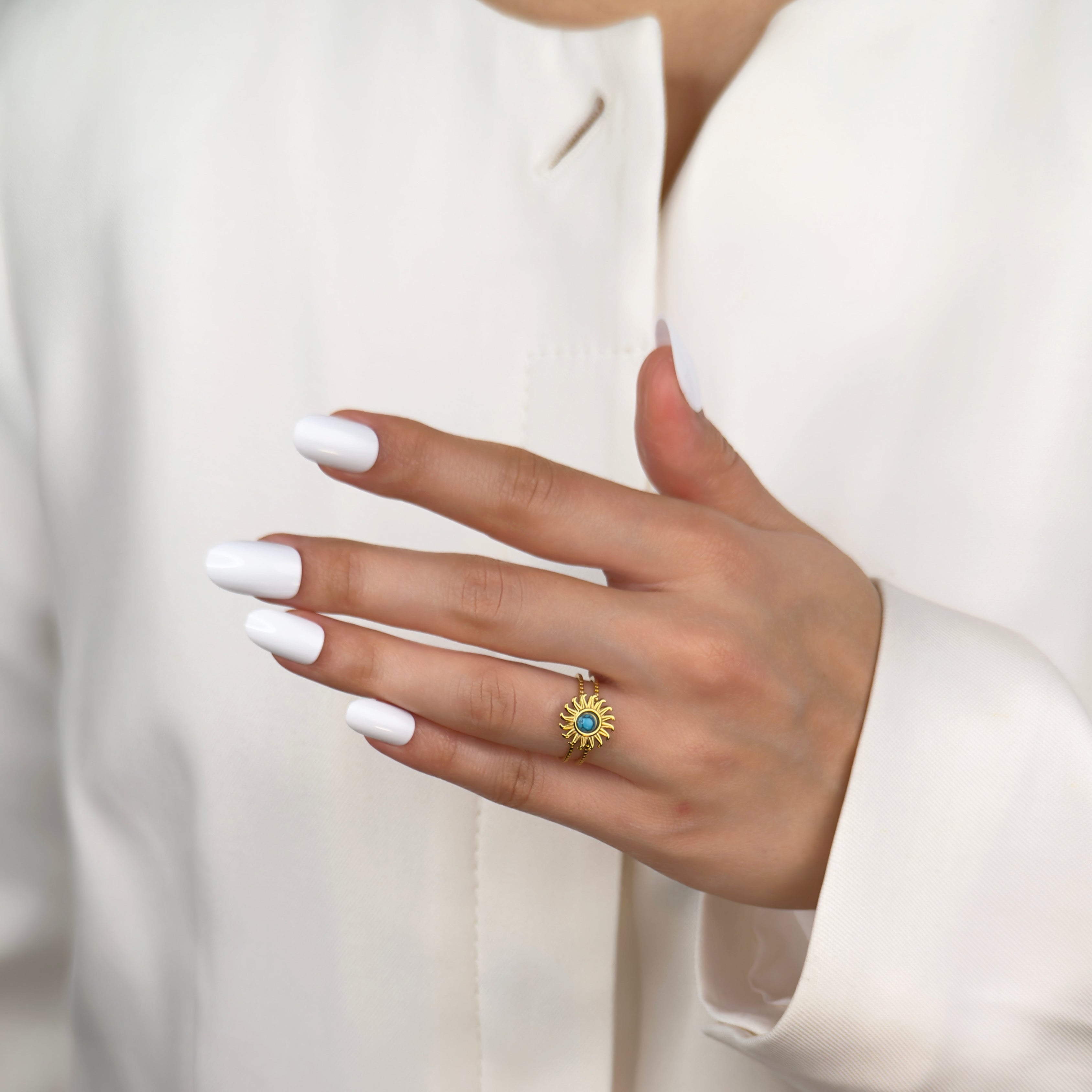 Gold cuff ring with turquoise sun design by Noble Aura UK