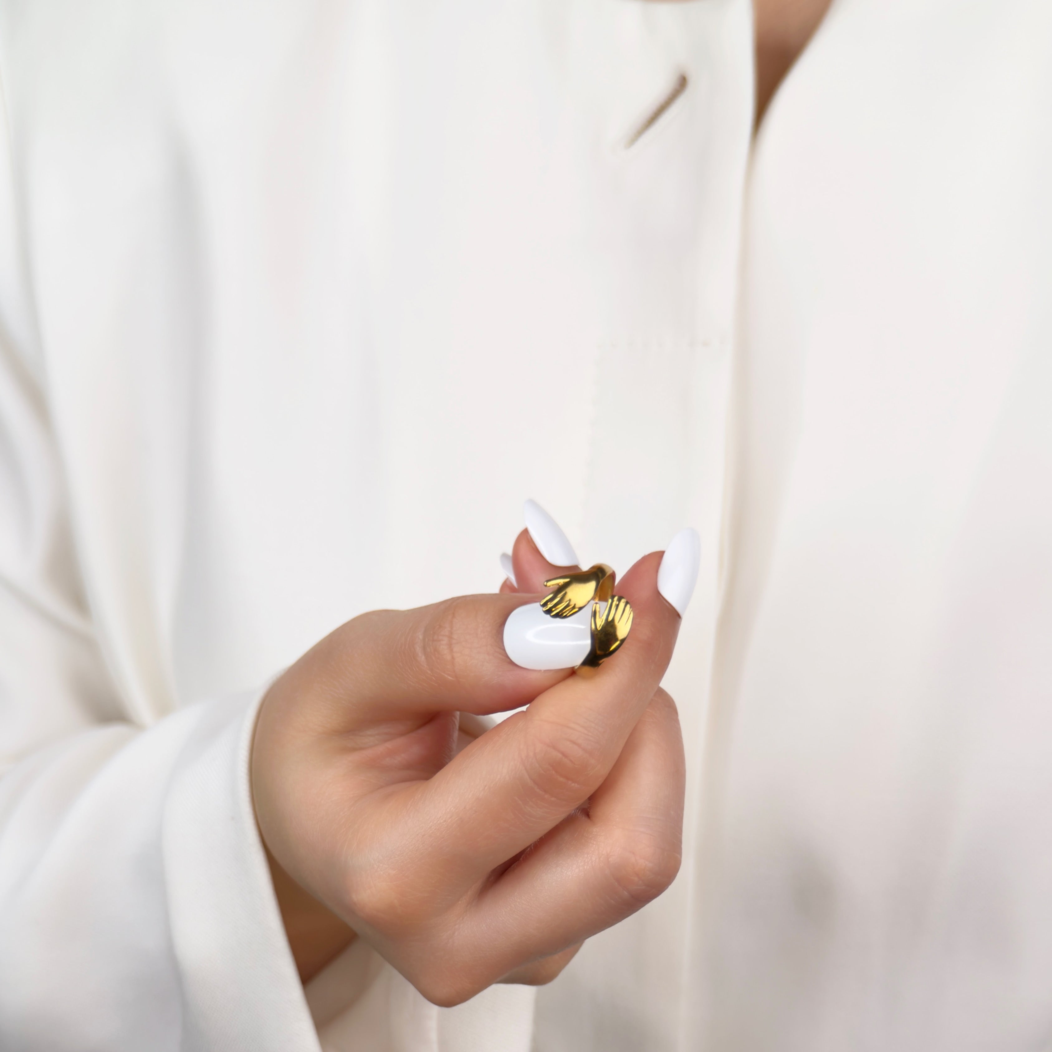 Gold angel hug adjustable ring with symbolic wrap design by Noble Aura UK
