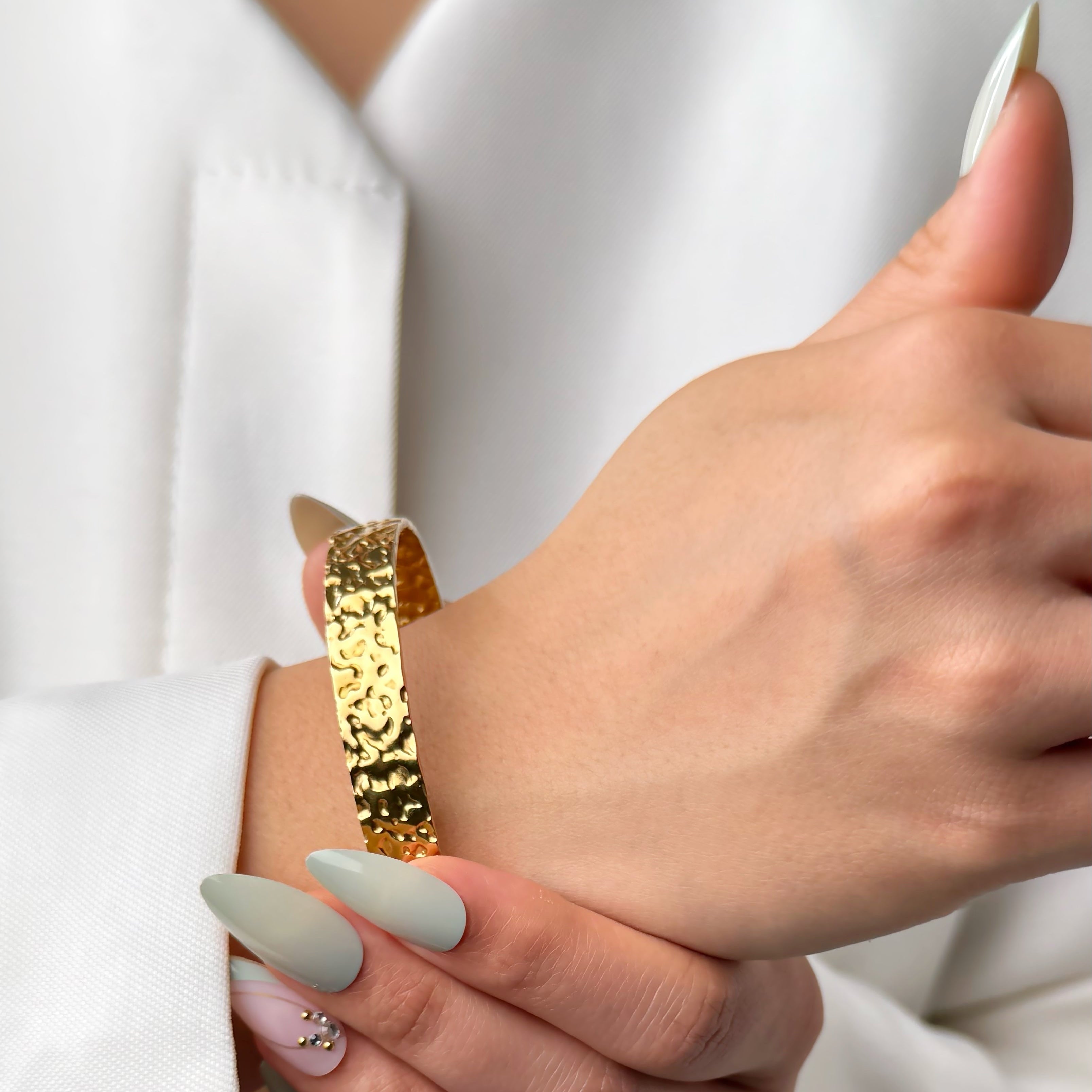 Hammered gold cuff bracelet with textured finish by Noble Aura UK
