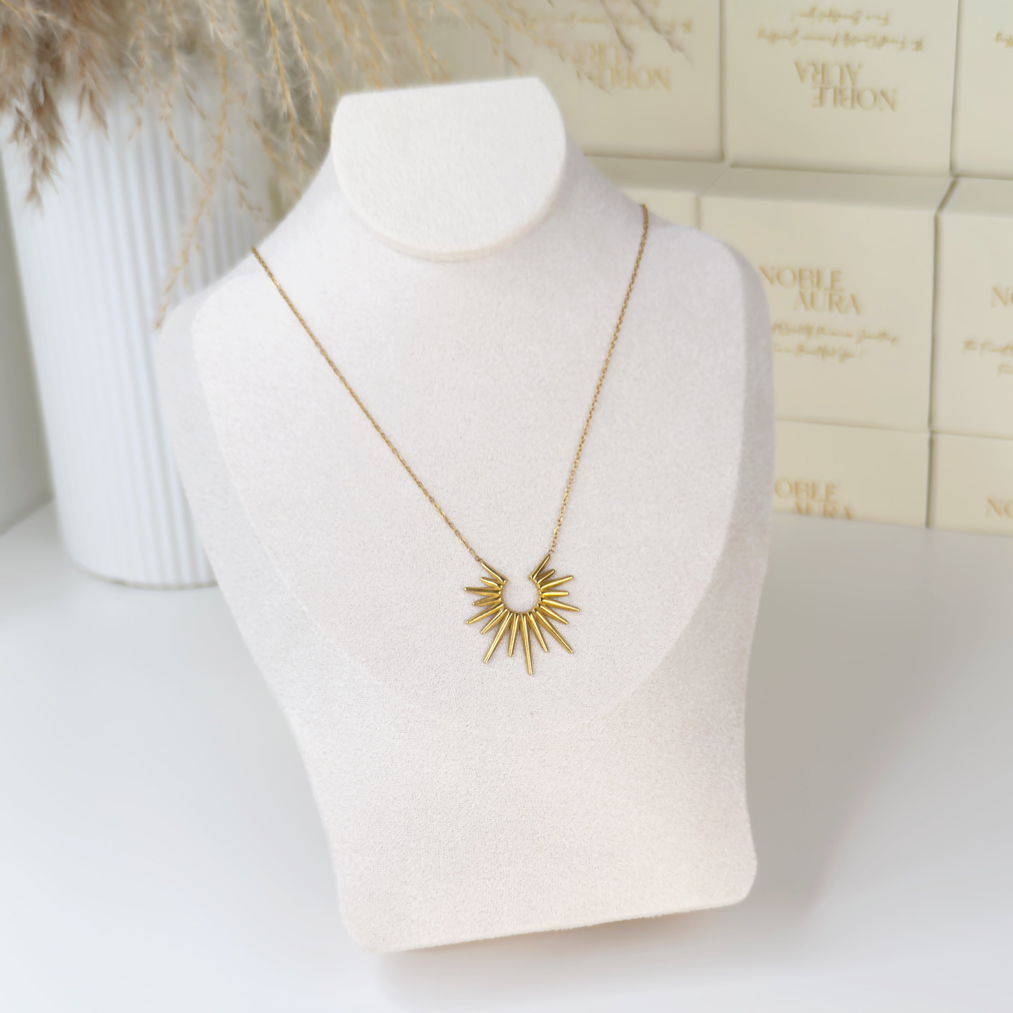 Gold sunburst pendant necklace with radiant textured design by Noble Aura UK. Comes in Premium packaging. Free Delivery over £50.