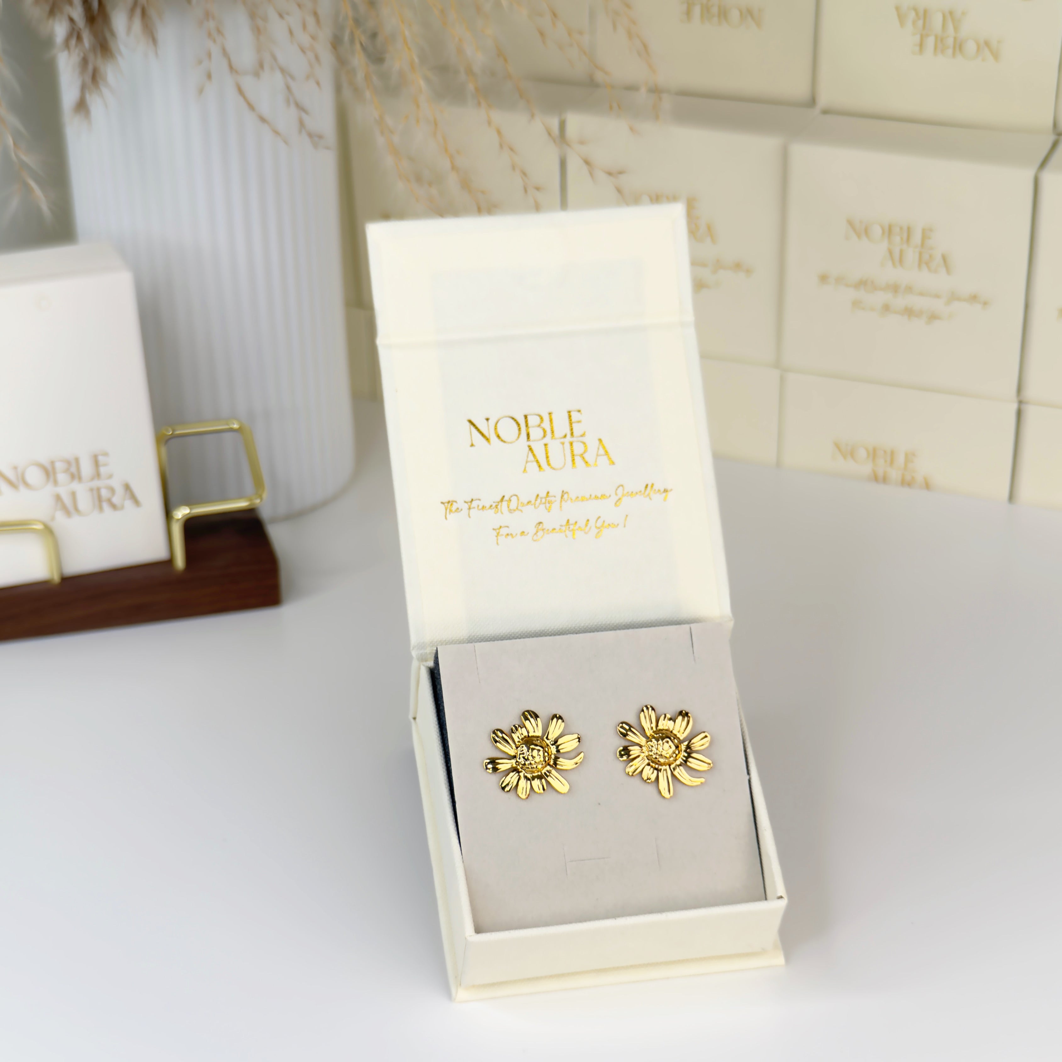 Gold daisy bloom stud earrings with floral detailing by Noble Aura UK
