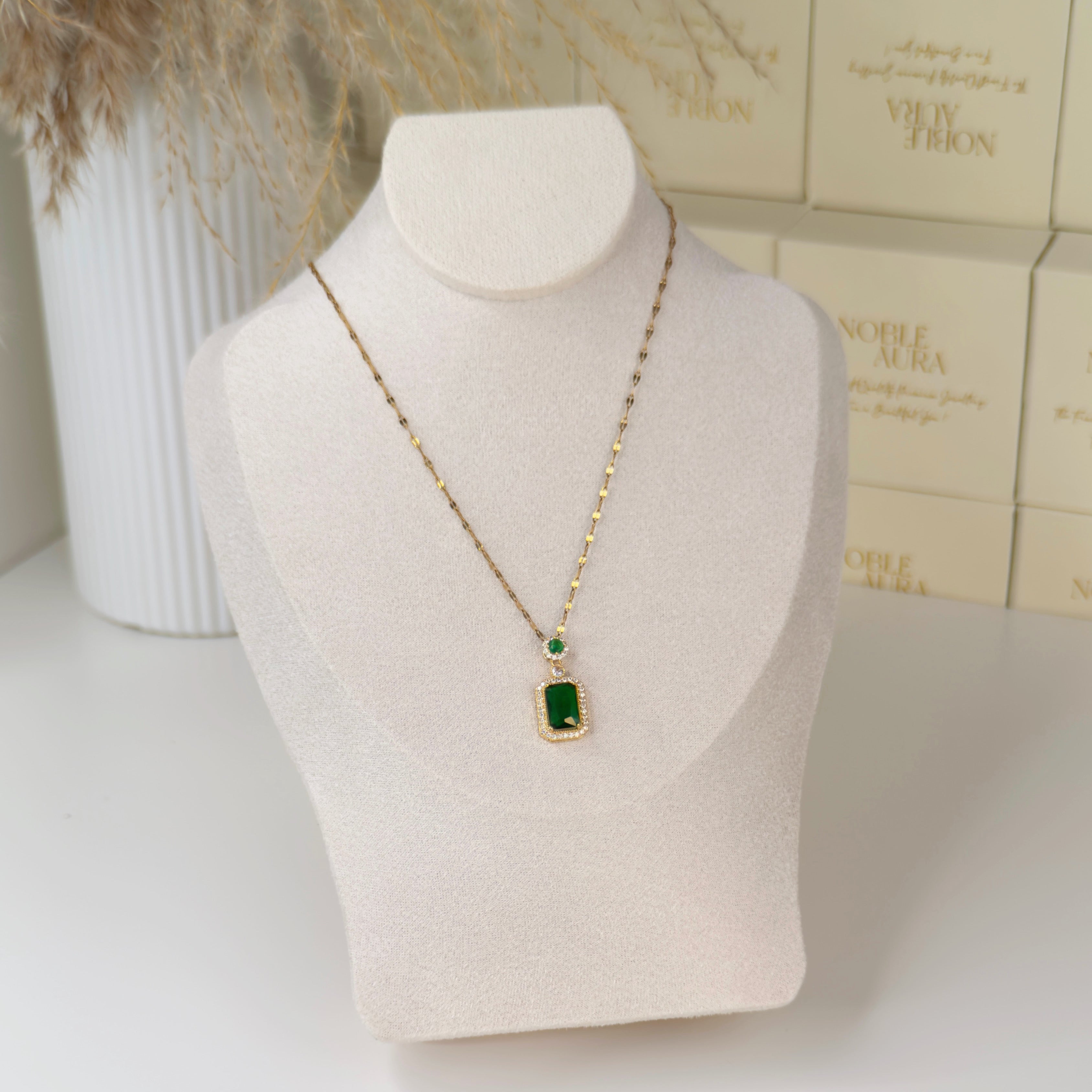 Gold emerald green pendant necklace with halo crystal detailing by Noble Aura UK