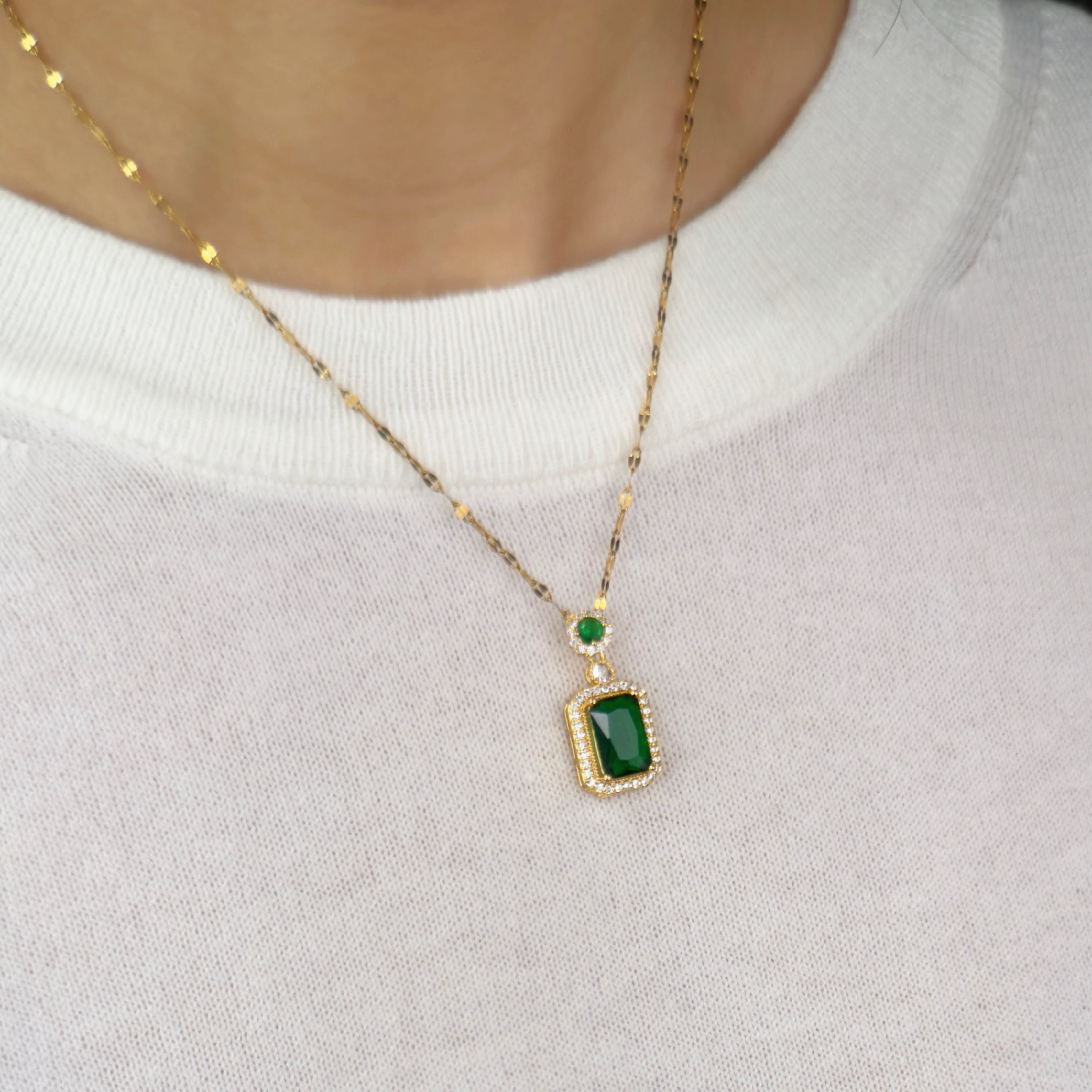 Gold emerald green pendant necklace with halo crystal detailing by Noble Aura UK