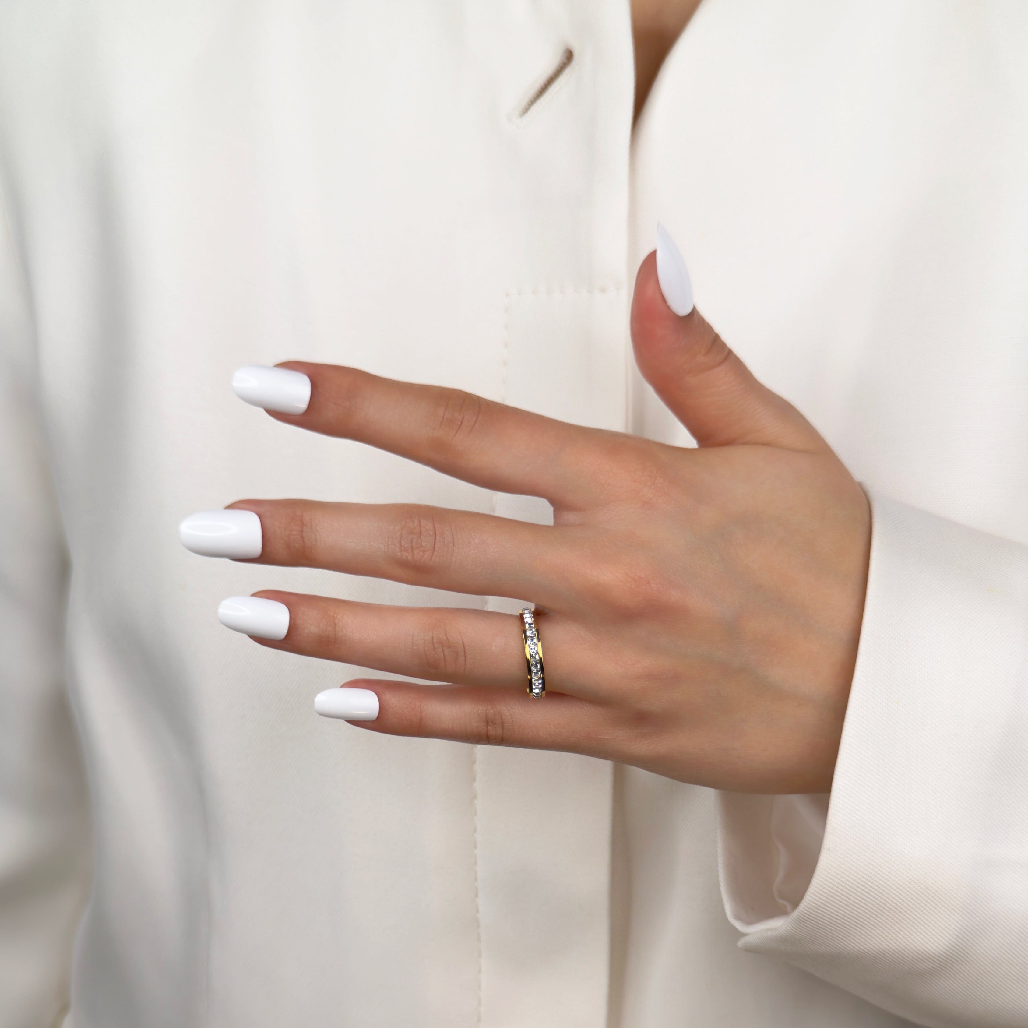 Gold eternity band ring with continuous stone detailing by Noble Aura UK
