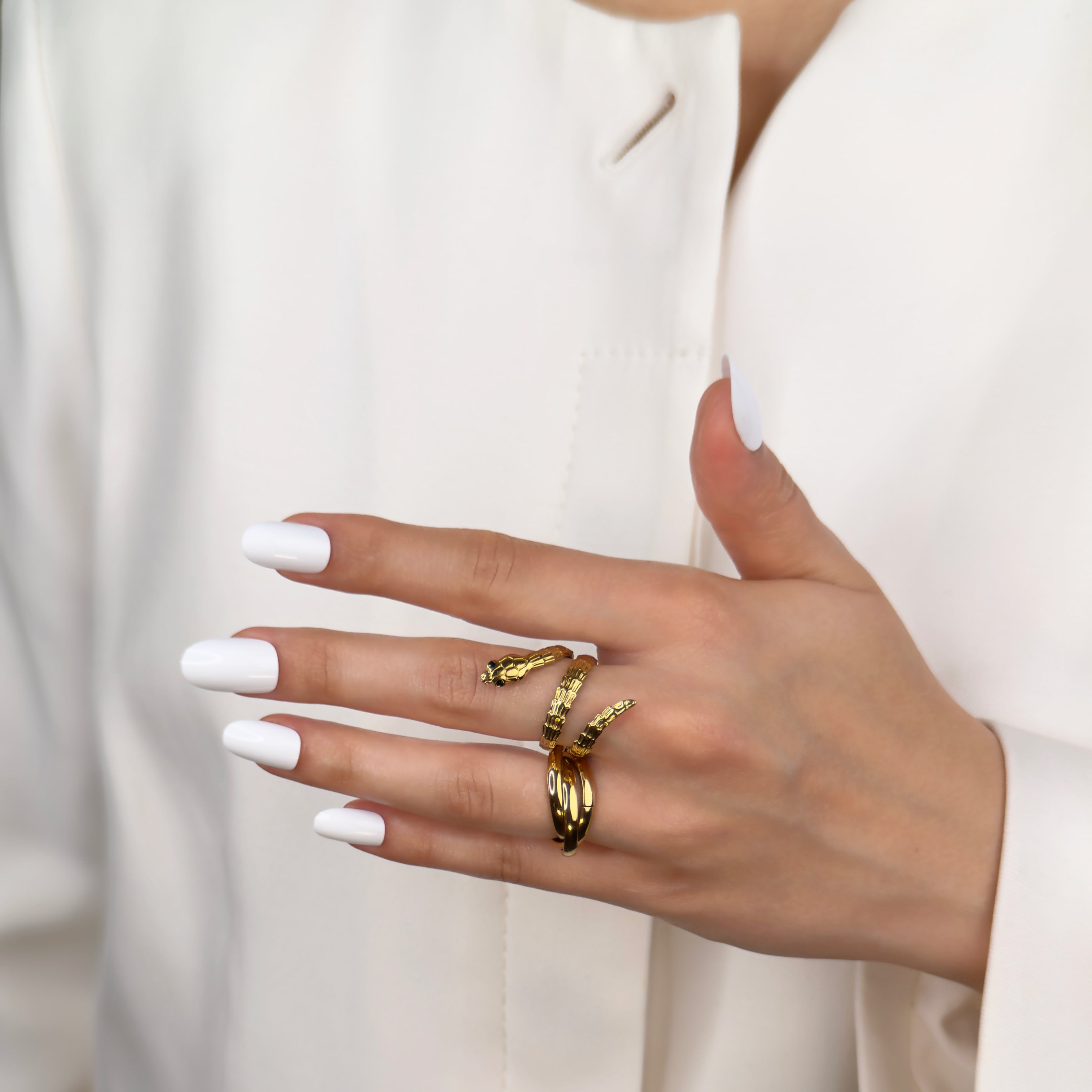 Gold trinity rolling ring with interlocking band design by Noble Aura UK
