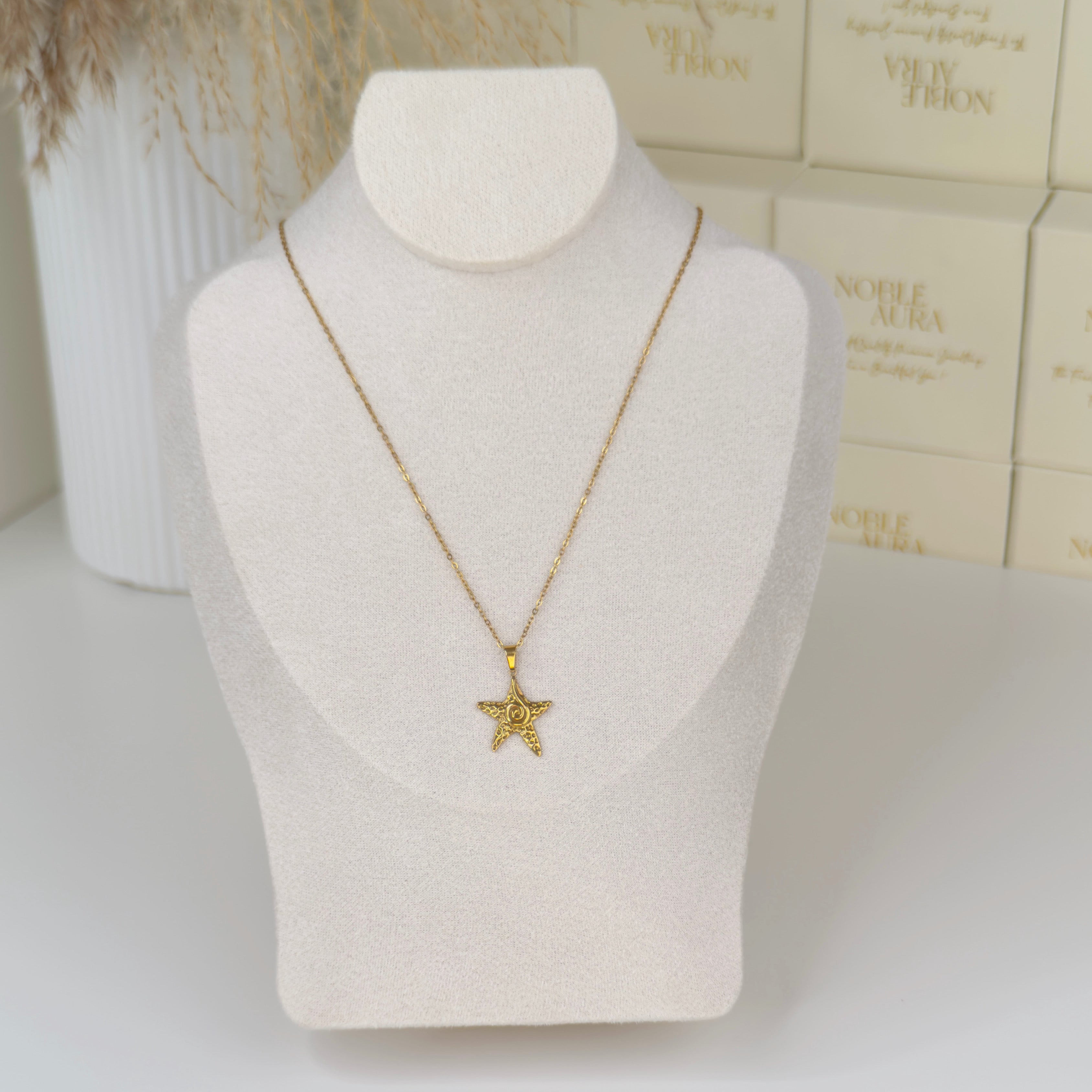 Gold starfish pendant necklace inspired by coastal elegance by Noble Aura UK
Comes in Premium packaging. Free Delivery over £50.
