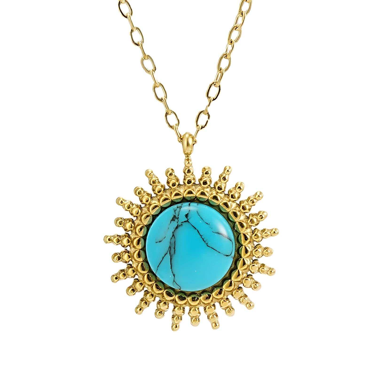 Gold sunburst pendant necklace with turquoise stone centre by Noble Aura UK
