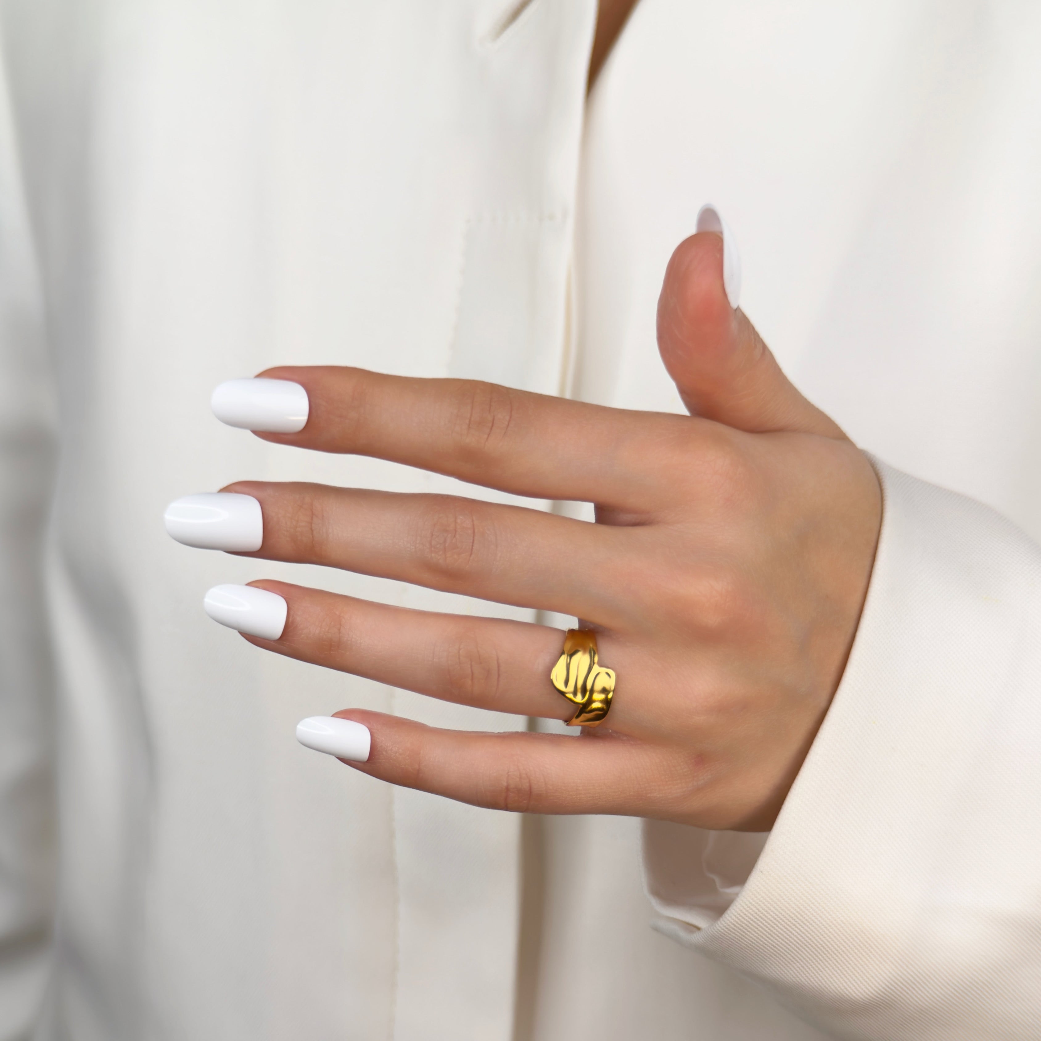 Gold wave ring with fluid curved design by Noble Aura UK
