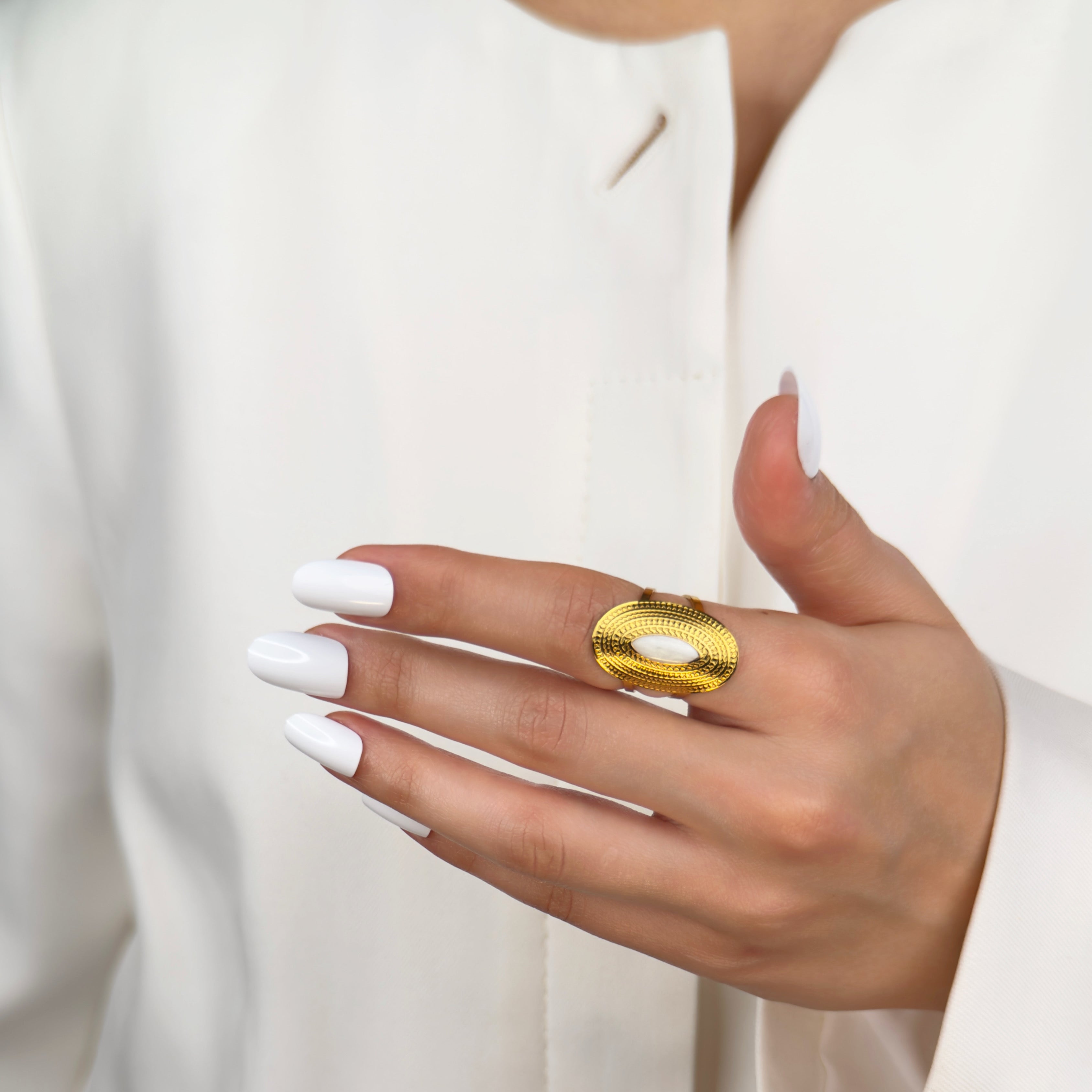 Gold oval ring with pearl centre and tribal detailing by Noble Aura UK

