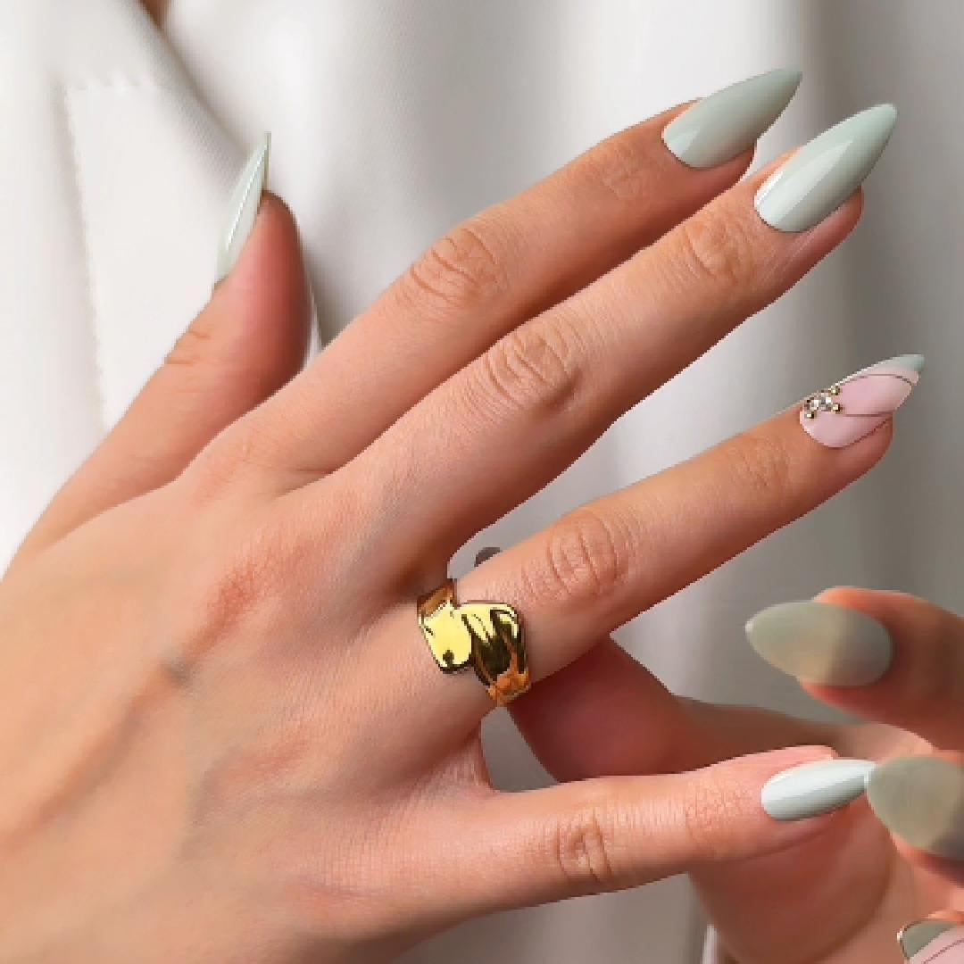 Gold wave ring with fluid curved design by Noble Aura UK
