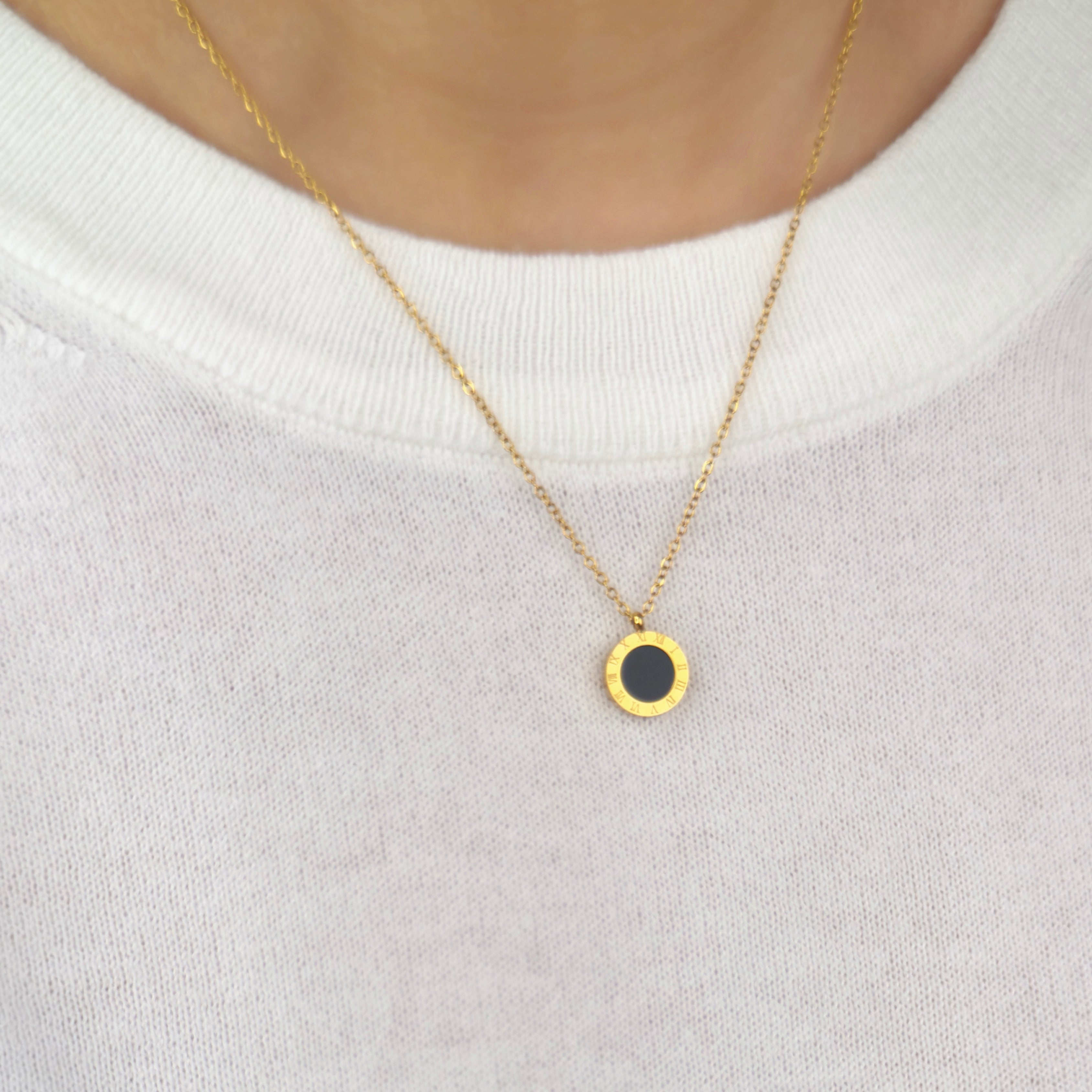 Gold Roman numeral pendant necklace with elegant detailing by Noble Aura UK. Comes in Premium packaging. Free Delivery over £50.

