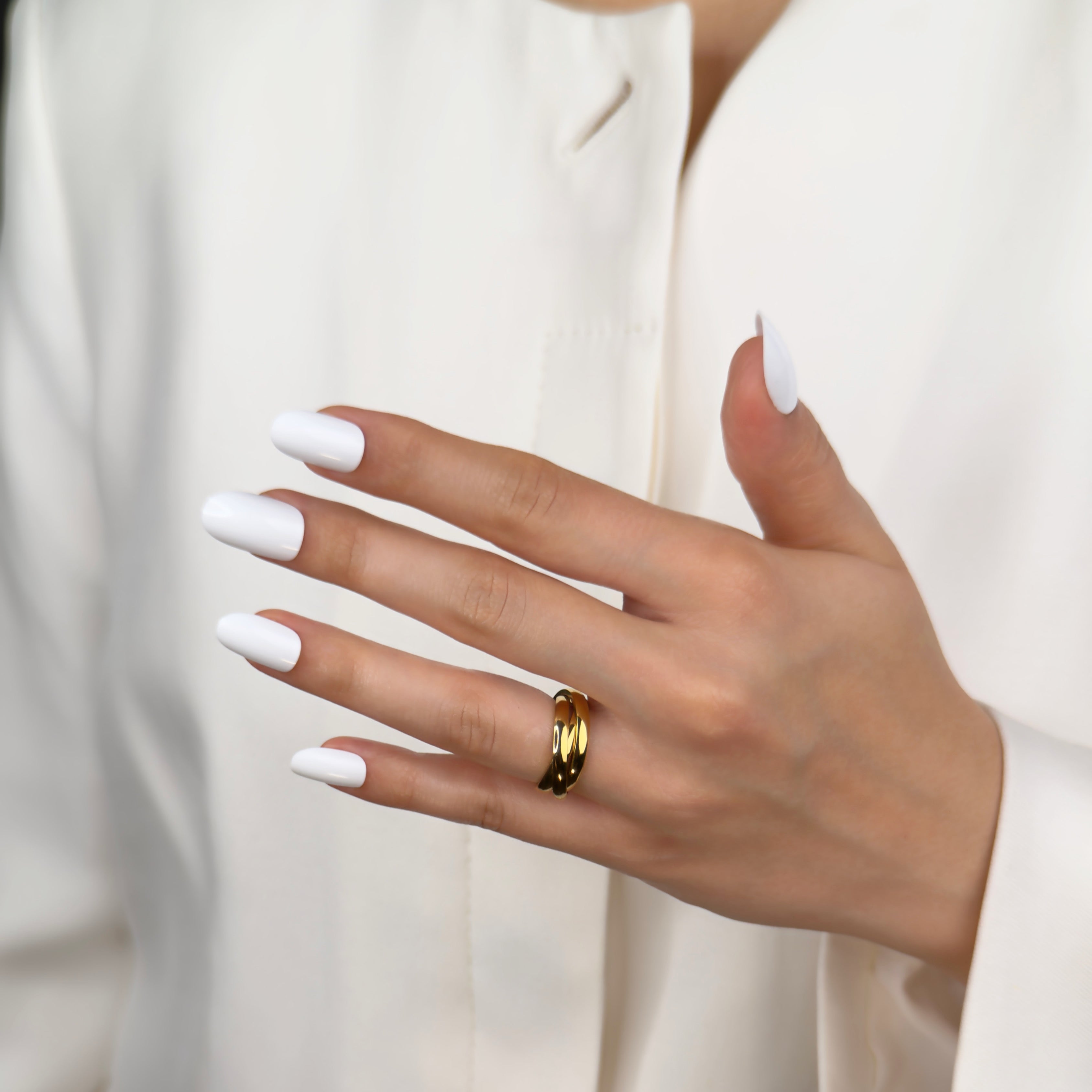 Gold trinity rolling ring with interlocking band design by Noble Aura UK